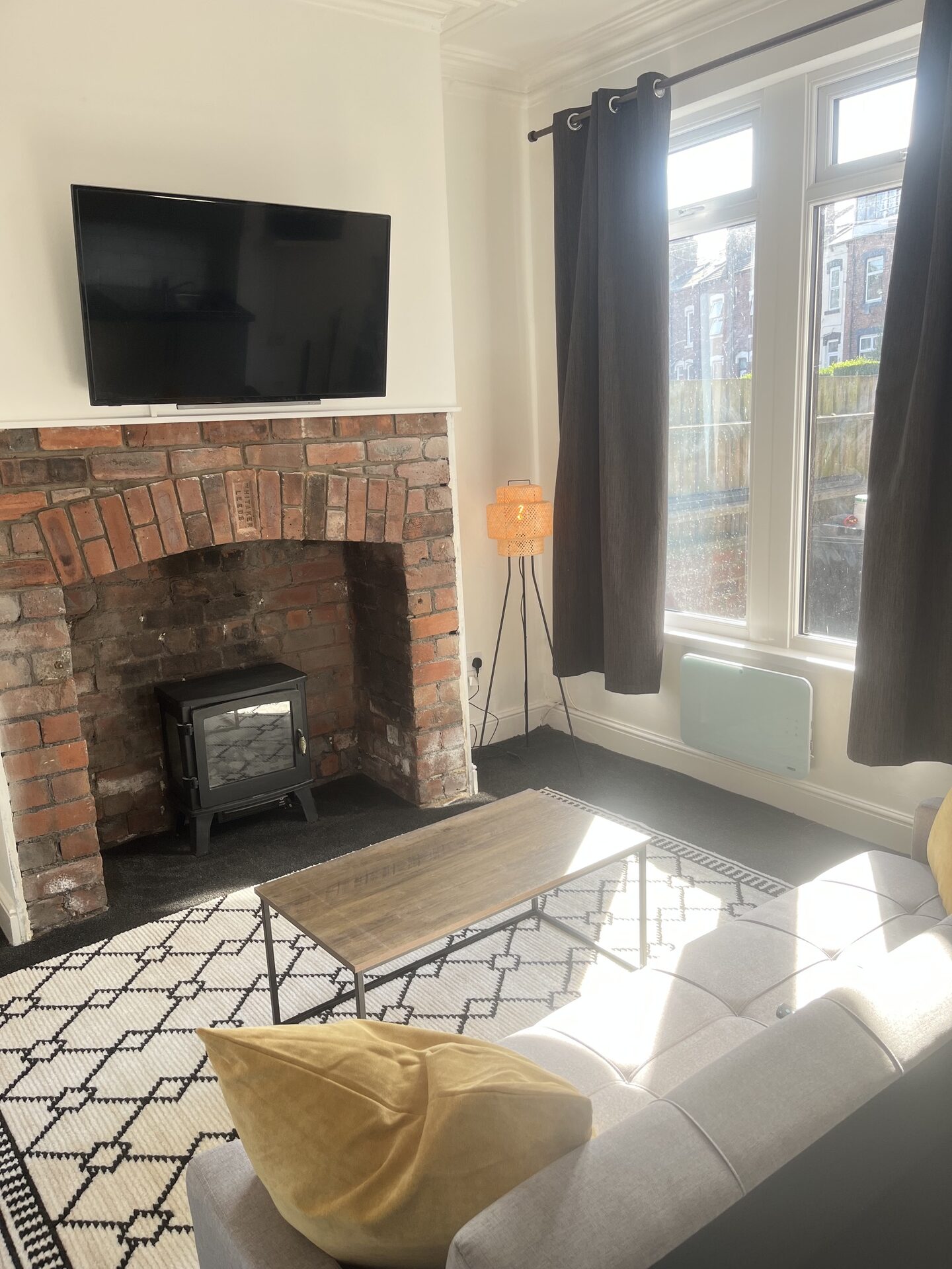 Floor 1 lounge with brick fireplace and log-burner at The Aberdeen House