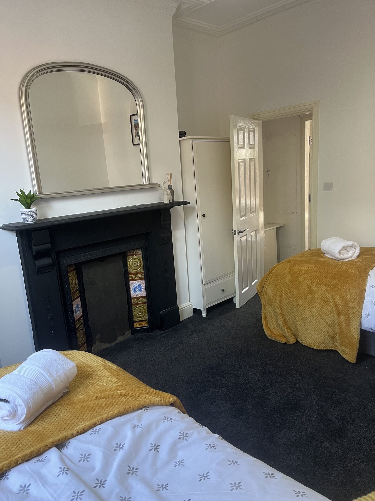 Bedroom with cast-iron fireplace at The Aberdeen House, Floor 1