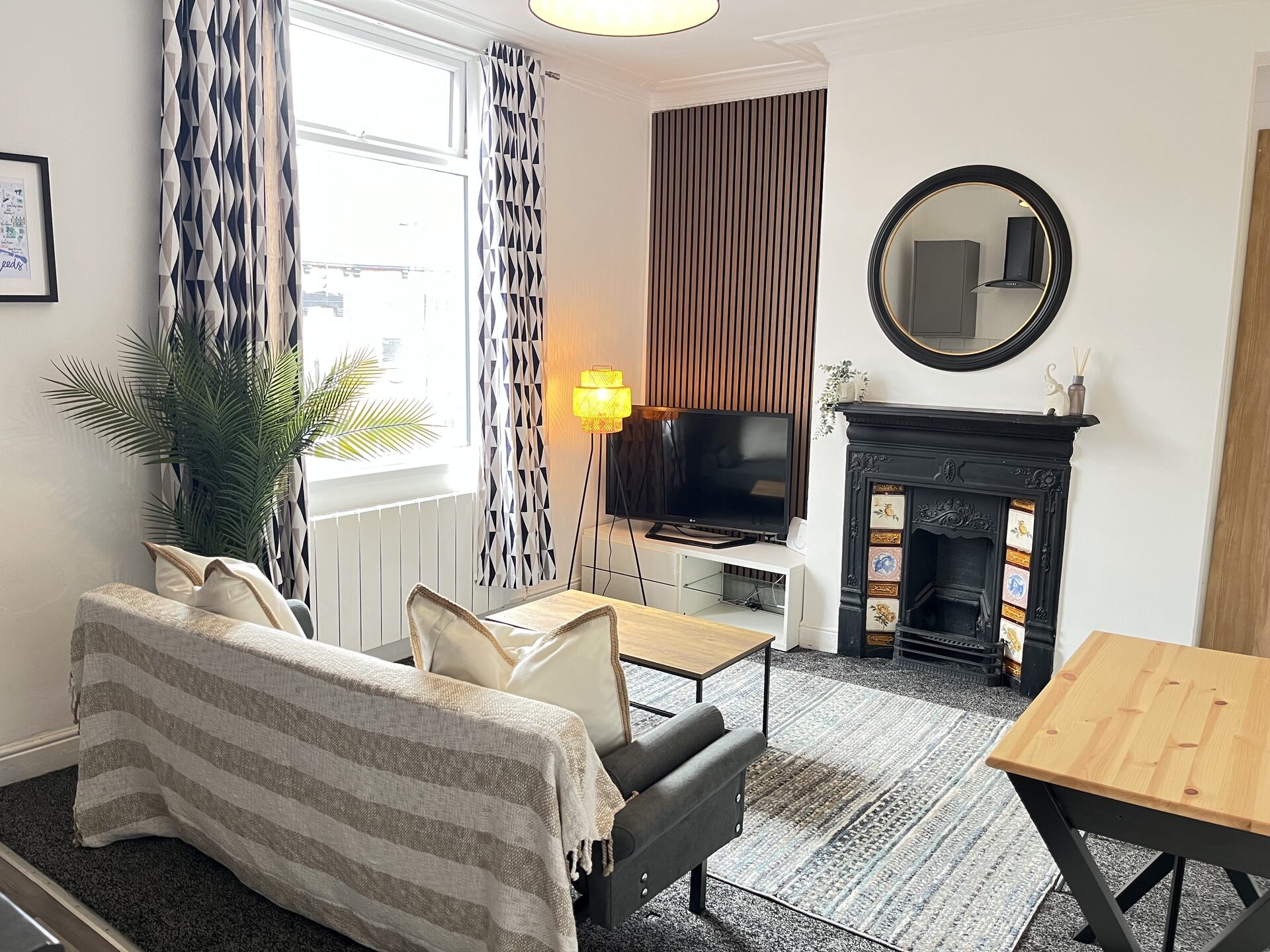 Floor 2 lounge with panelled feature wall and cast-iron fireplace at The Aberdeen House