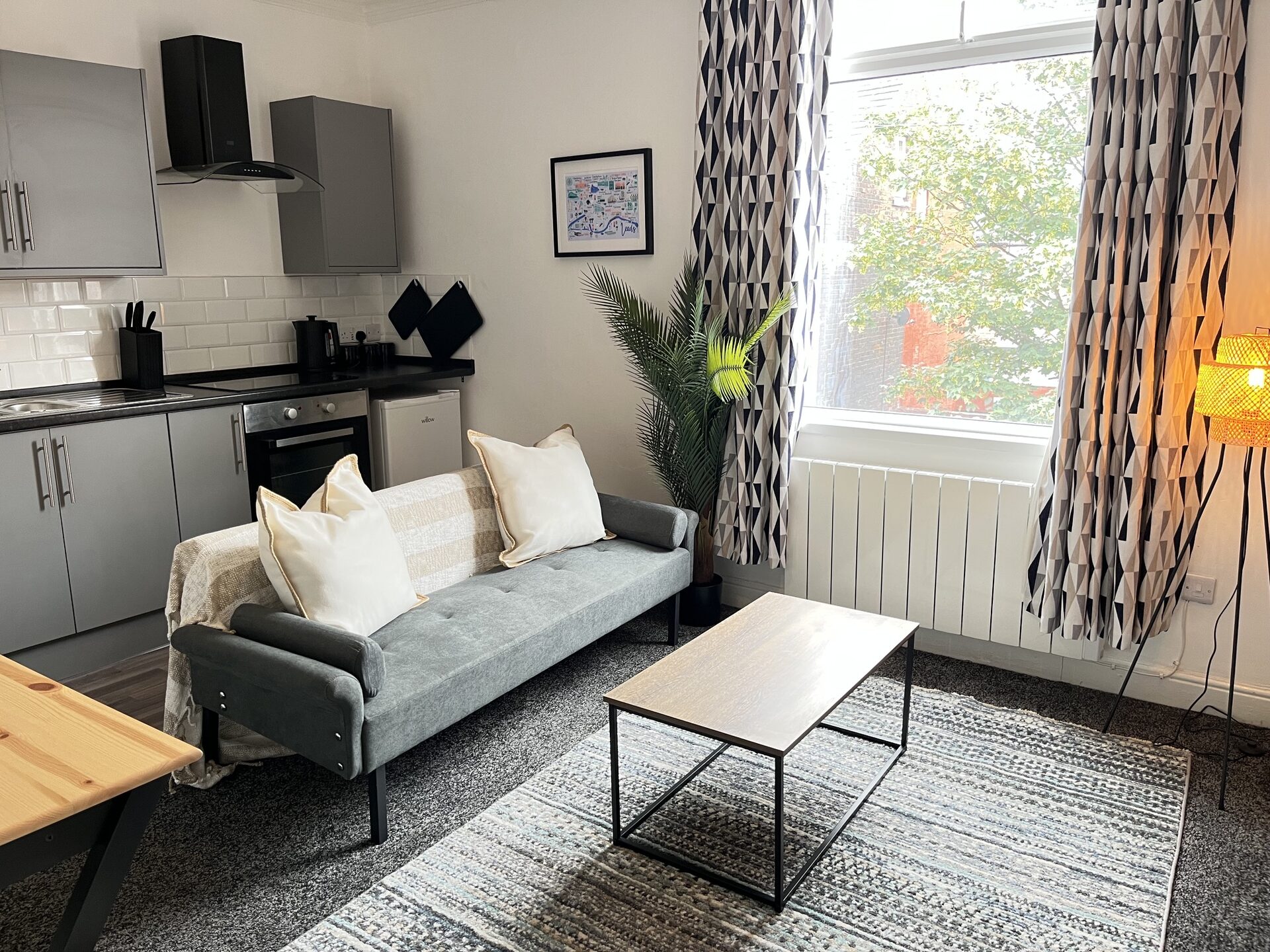 Kitchenette with sofa and window at The Aberdeen House, Floor 2