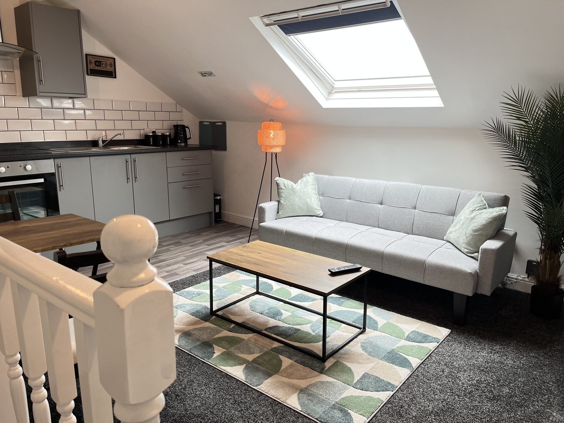Attic lounge — sofa under the skylight at The Aberdeen House, Floor 3