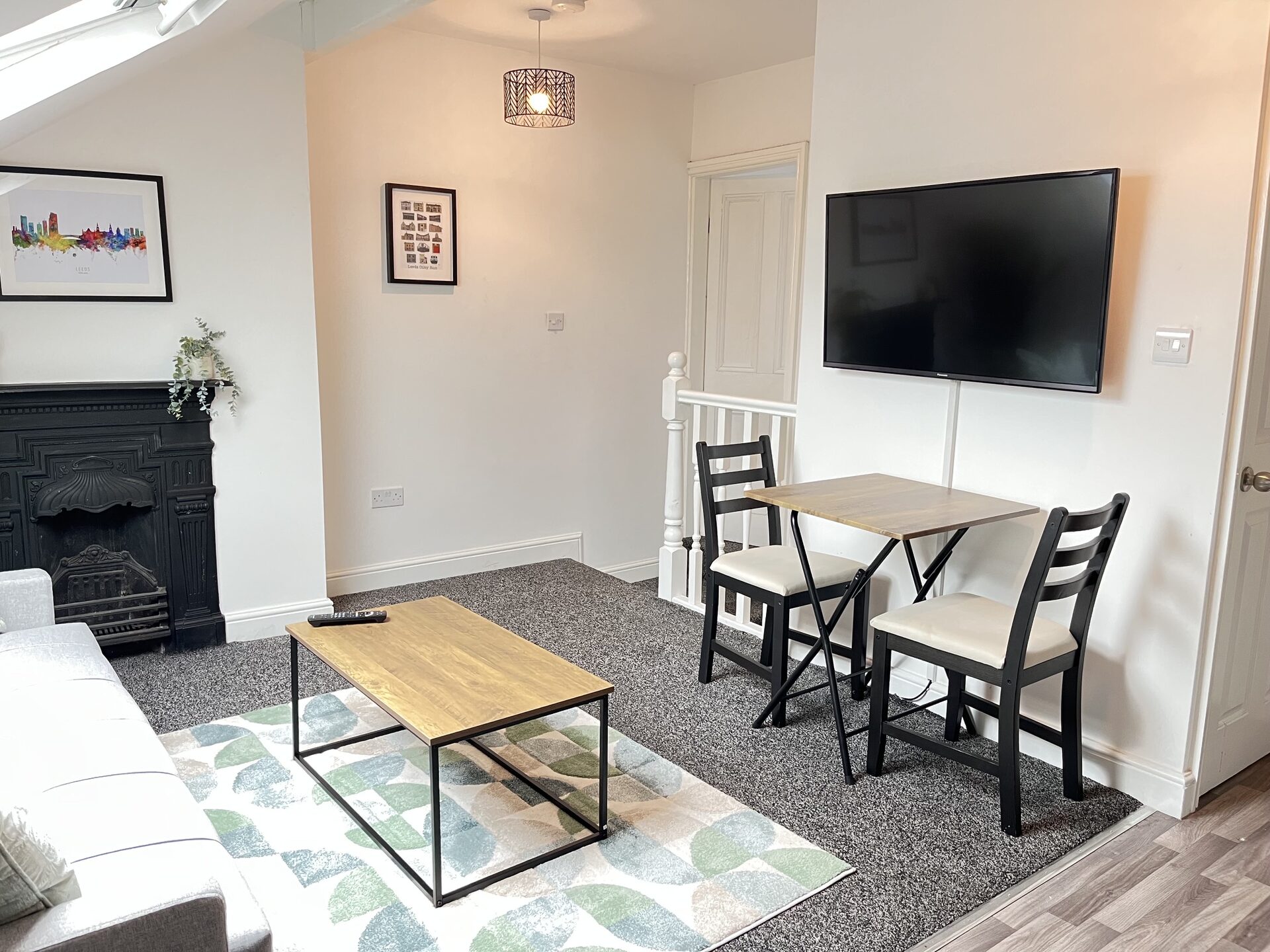 Living room with TV and dining table at The Aberdeen House, Floor 3