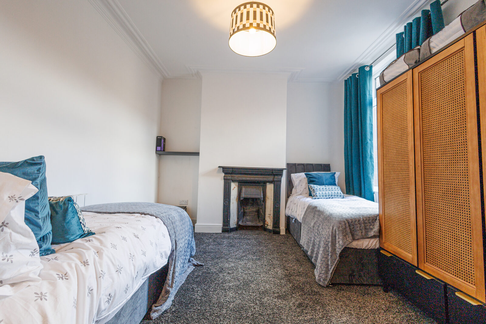 Twin bedroom with original fireplace at The Aberdeen House, Floor 2