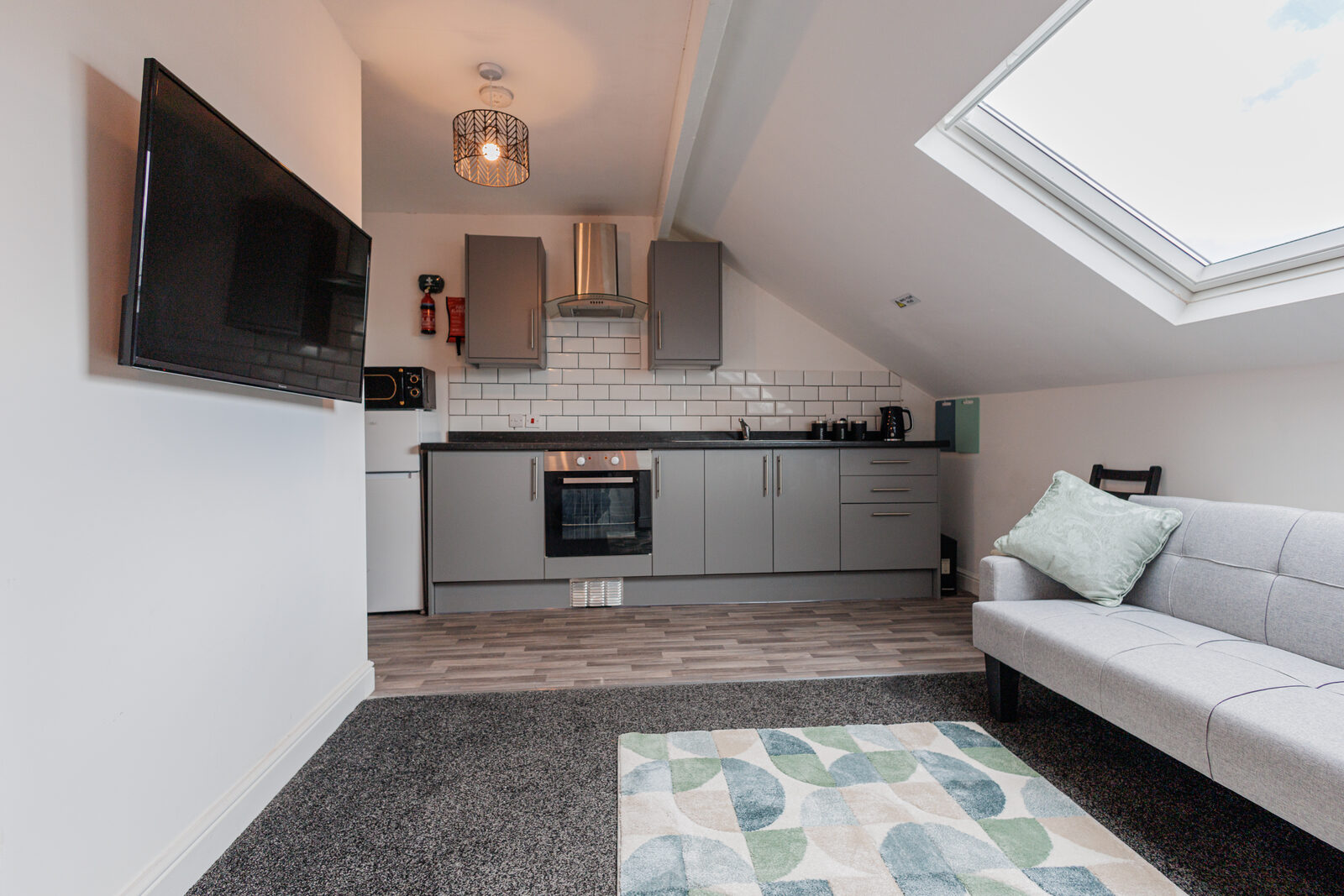 Attic lounge with skylight and kitchenette at The Aberdeen House, Floor 3